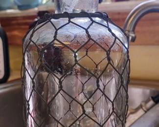 Decorative bottle wrapped in chicken wire