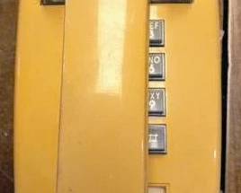 Vintage yellow push button phone