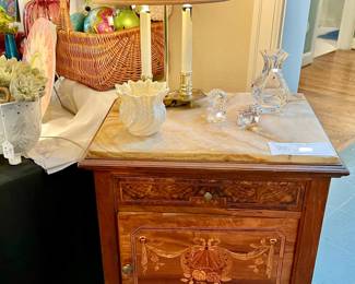 French marble top commode with wood inlay design.