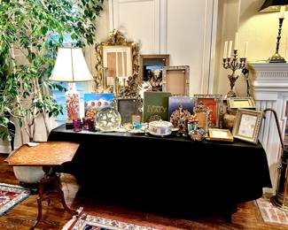 Vintage Italian area with frames, books, candlesticks.