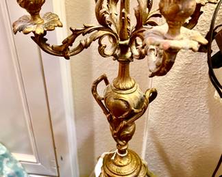 Pair of gold French candelabras with marble base.