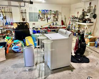 Garage with hand and power tools, gardening.