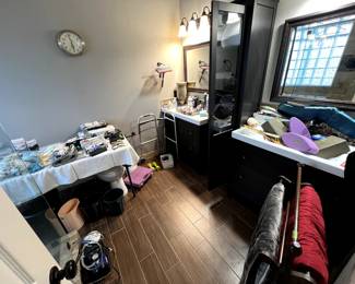 bathroom with lots of medical items, neck pillows, full bottles of shampoo, etc