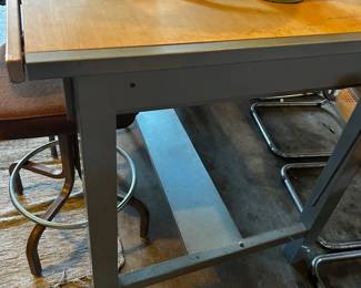 Drafting table with tilting top