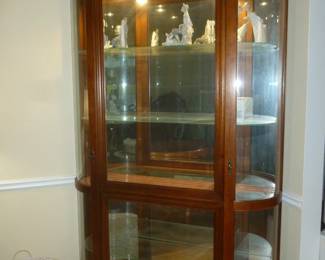 Large curved glass curio cabinet