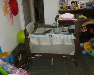 Unique Pack-N-Play..has 2nd level on top for smaller children and changing tray that attaches