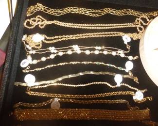 close-up of chains & bracelets