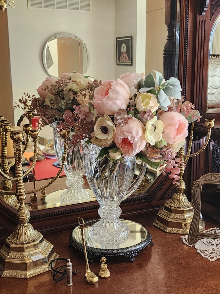 Crystal vase, floral boquet, worlds fair bubble necklace.