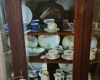 Another china cabinet filled with china