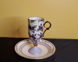 A Demitasse Cup And Saucer
