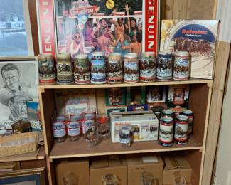 Budweiser - Includes several brand new 4 packs of glasses, brand new yearly steins, unboxed steins, awesome vintage sign that changes images. 