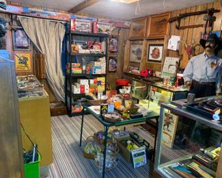 Ammunition, belt buckles, TONS of knives including antique and vintage military, Vintage collectors BB guns (Daisy Red Ryder and several Roy Rogers collection that are all new in box). 