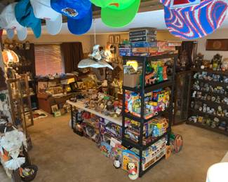 A view from the main staircase looking down into the living room filled with owls and toys.