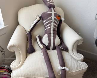 Upholstered Chair, Skeleton Pillow