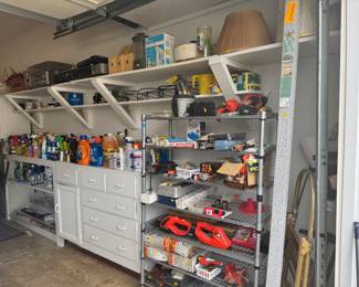 Garage with hand tools and cleaning supplies