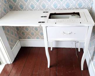 Sewing table with machine