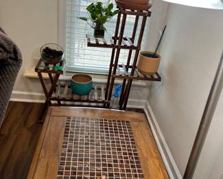 Oak side table with copper colored tile top, plants