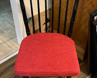 Four black Hitchcock style chairs with cushions