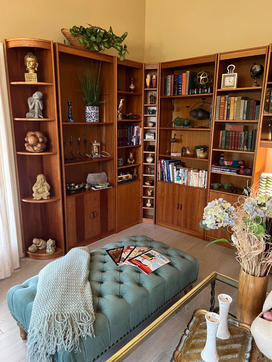 Scandinavian bookcases and wall unit, collectibles, bench, books.