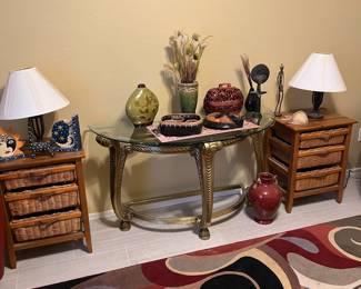 Wicker and cane drawer units, decor, glass and metal sofa table, rug.