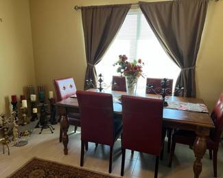 Table and chairs, candlesticks.