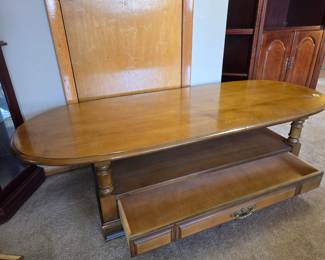 #4 Wood Oval Top Coffee Table w/1 drawer * Shelf (as is small water damage on top) - 60x24x16 $60.00