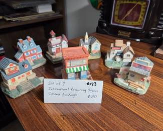#123 Set of 7 International Resourcing Services ceramic buildings $20.00