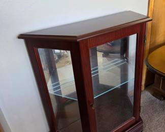 #6 Laminate Half-Moon Display Cabinet - lighted w/1 glass shelf w/plate rack etched in back of glass - 28x11x29 $65.00