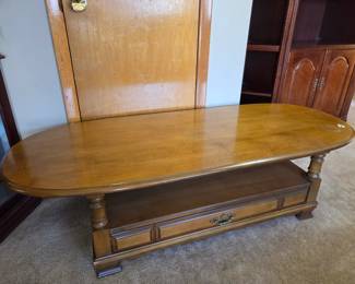 #4 Wood Oval Top Coffee Table w/1 drawer * Shelf (as is small water damage on top) - 60x24x16 $60.00
