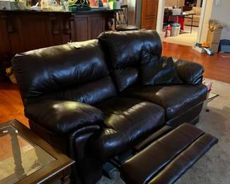 #24	 	double recliner brown leather sofa as is lift of recliner 74 wide	  $133.00 
