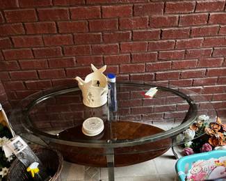 #26	table-kit	oval glass top coffee table with metal legs and shelf 48x28x20	 $32.00 	   		
