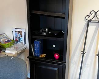 #328		Black laminate shelf (2) with 1 door 24x17x76	 $50

