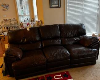 #25 double recliner brown leather sofa with middle cup holder 89 long as finish 	 $160.00 	  