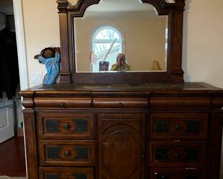 #3	Ashley dresser with 12 drawers, bevel mirror  leather design on drawer stone top68Wx19Dx44T mirror 50x41	 $137.00 	   		
