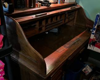 #62	desk pr	Wood 2 pc Desk w/roll-top & cubbies w/9 drawers (as is condition) - upstairs 52x28x30-47 - (needs to be removed at the end - locked into the barbie room upstairs)	 $100.00 			
