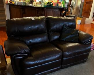 #24	 	double recliner brown leather sofa as is lift of recliner 74 wide 	 $133.00  		
