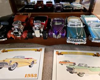 More large scale diecast cars.
Actual original calendars in the foreground. The one on the right is dated 1957.