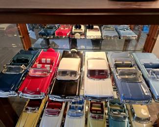 Over 40 large scale diecast cars. This is one shelf.