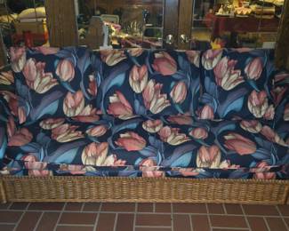 Rattan sofa, there's also a matching chair, lounge chair, coffee table, end tables and bar.