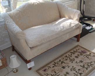 loveseat and small rug