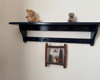 Black shelf with 4 pegs