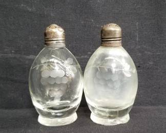Lot # : 130 - Pair of salt and pepper shakers with sterling caps