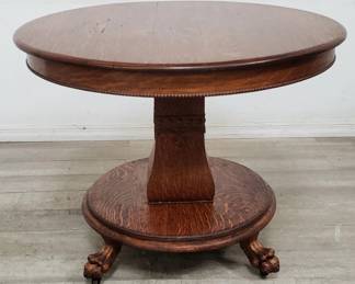 Lot # : 122 - Antique carved tiger oak round table on casters