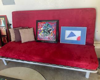  red futon  has a striped cover also   !!