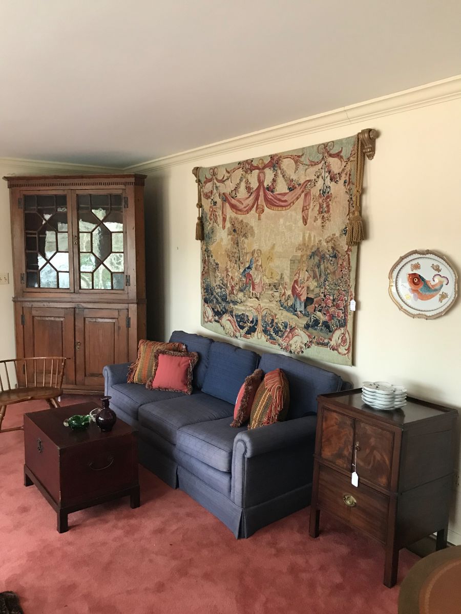 Mid Century Tapestry hanging over blue upholstery sofa