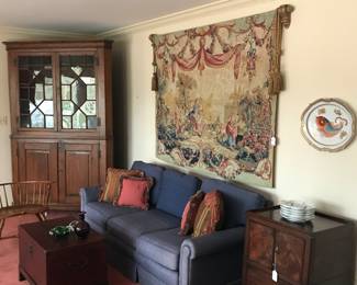 Mid Century Tapestry hanging over blue upholstery sofa