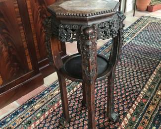 Teak marble topped stand. 32 1/2” tall.  14” across top 