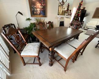Antique dining table with pull out leaves and 6 chairs