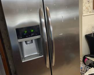 Frigidaire side-by-side stainless steel refrigerator in perfect working condition