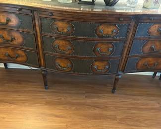 Beautiful buffet with metal inset on top, pull out shelves on front are leather covered.